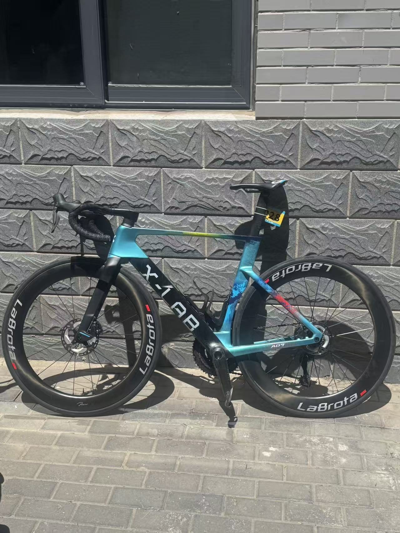 Blue bike night side profile