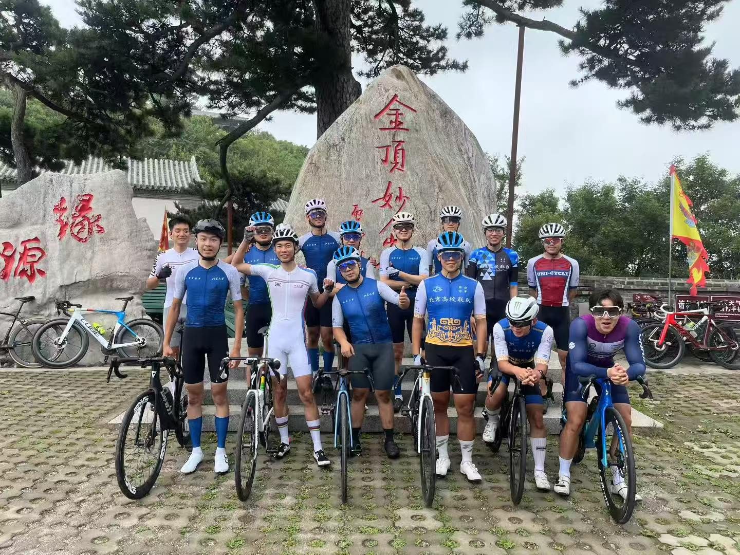 Group photo at mountain landmark