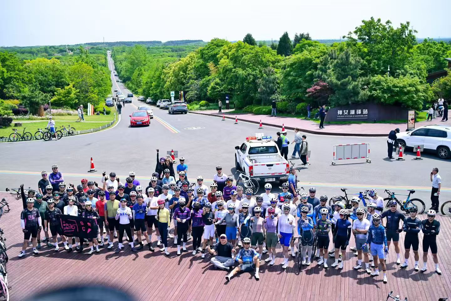 Large cycling group photo at the event meeting point