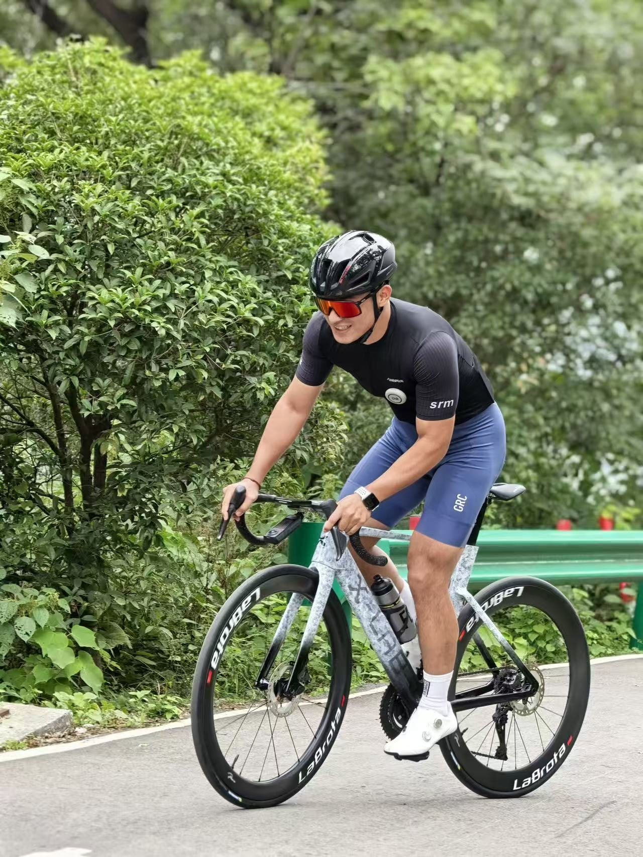 Captain Cola smiling on LaBrota bike during green roadside ride