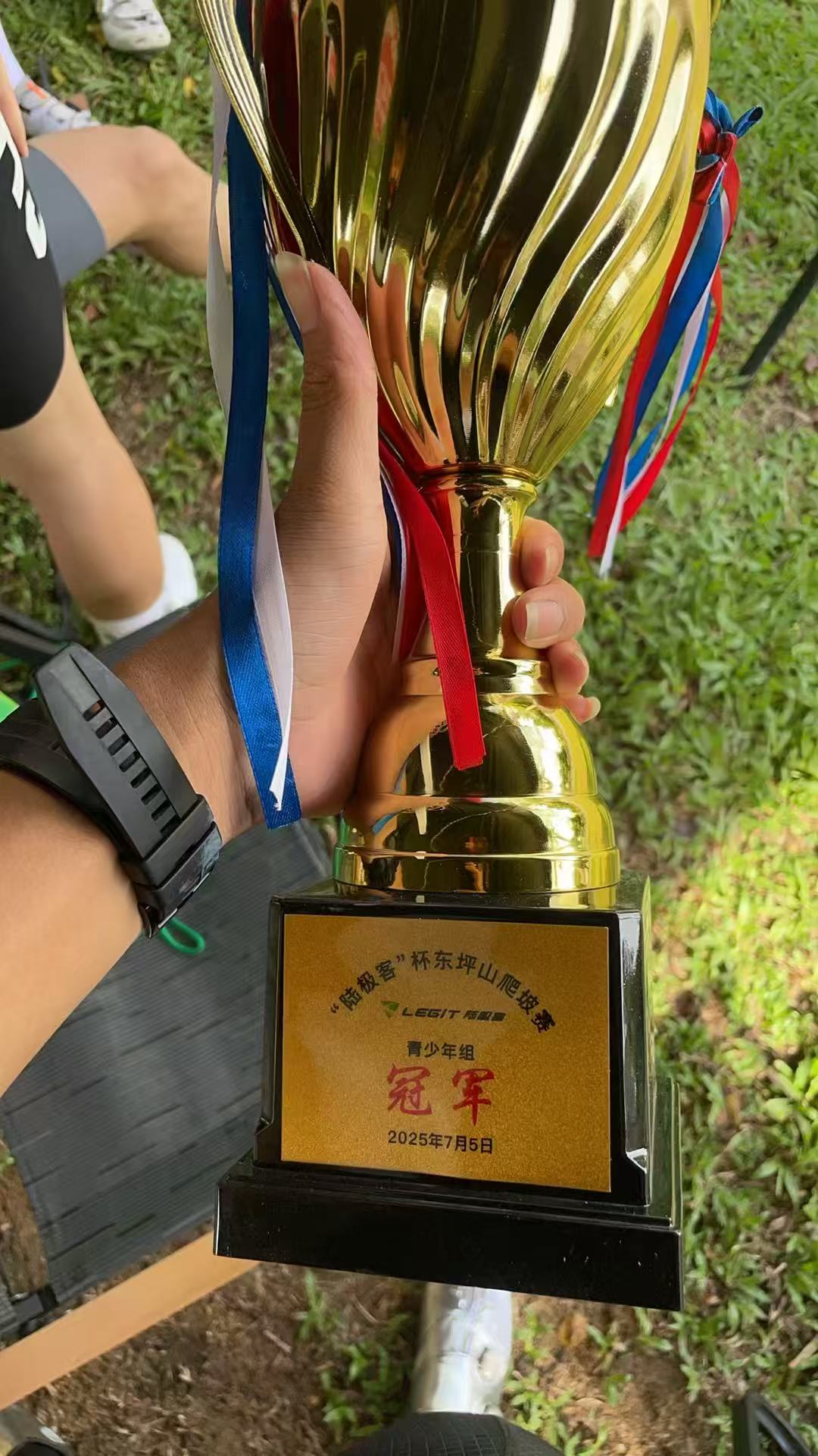 Close-up of Louis holding a winner trophy